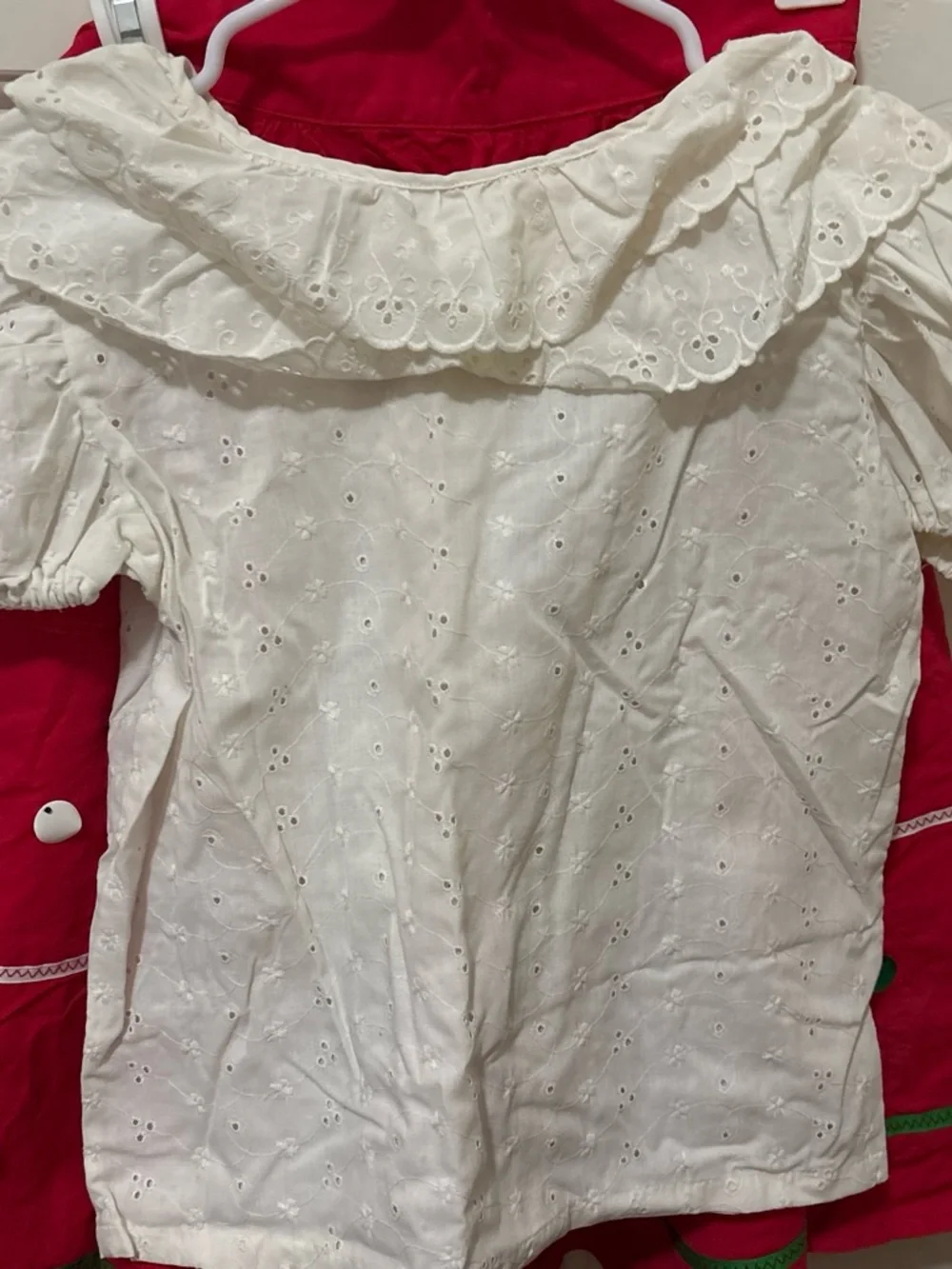 Folclórico Red skirt with white polka dots and green trim, with a white top and
